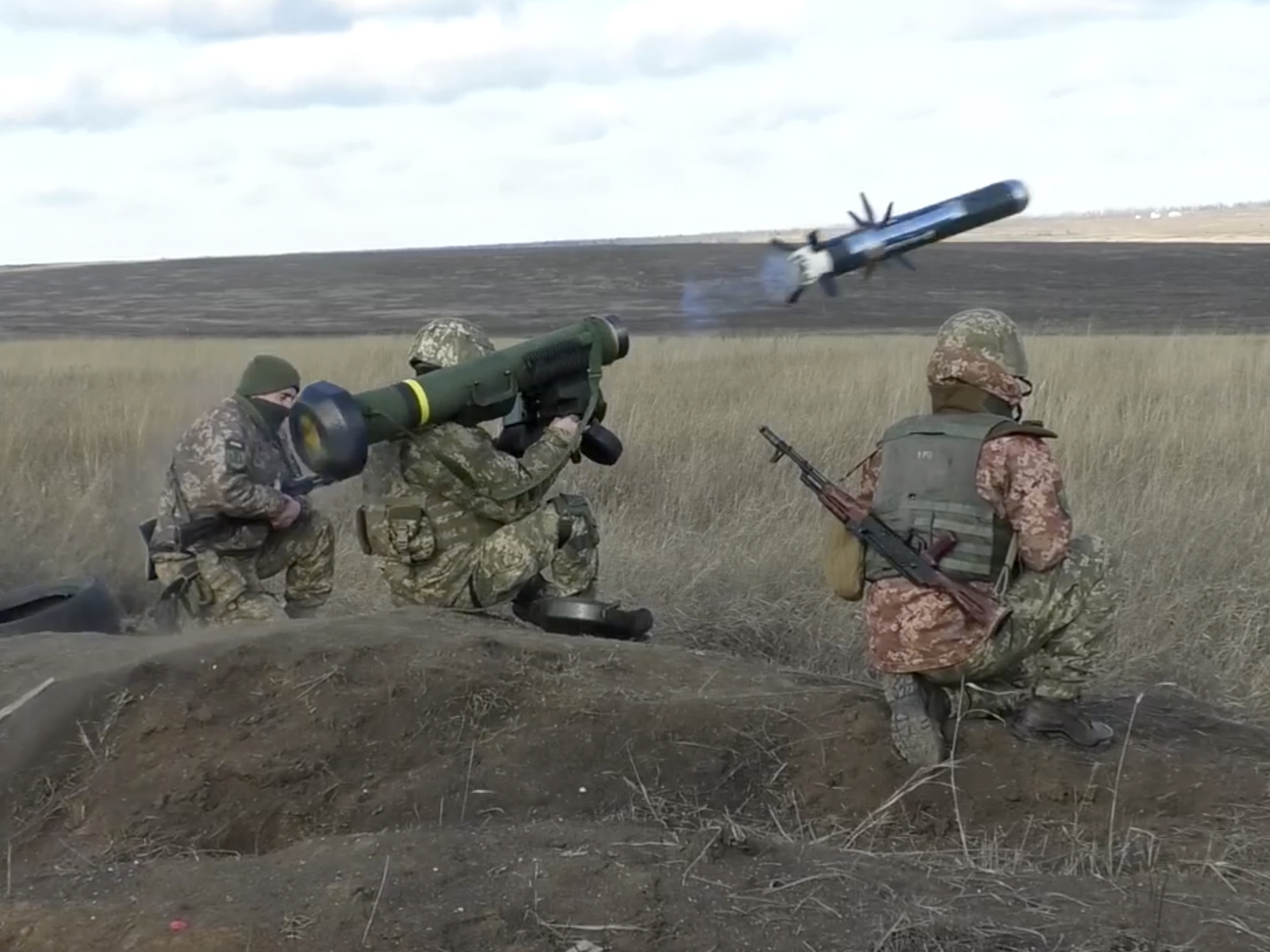 caption: In this image taken from footage provided by the Ukrainian Defense Ministry Press Service, Ukrainian soldiers use a launcher with U.S. Javelin missiles during military exercises in the eastern Donetsk region of Ukraine, on Jan. 12. The U.S. and NATO allies have been ramping up military aid to help Ukraine fend off Russian forces.