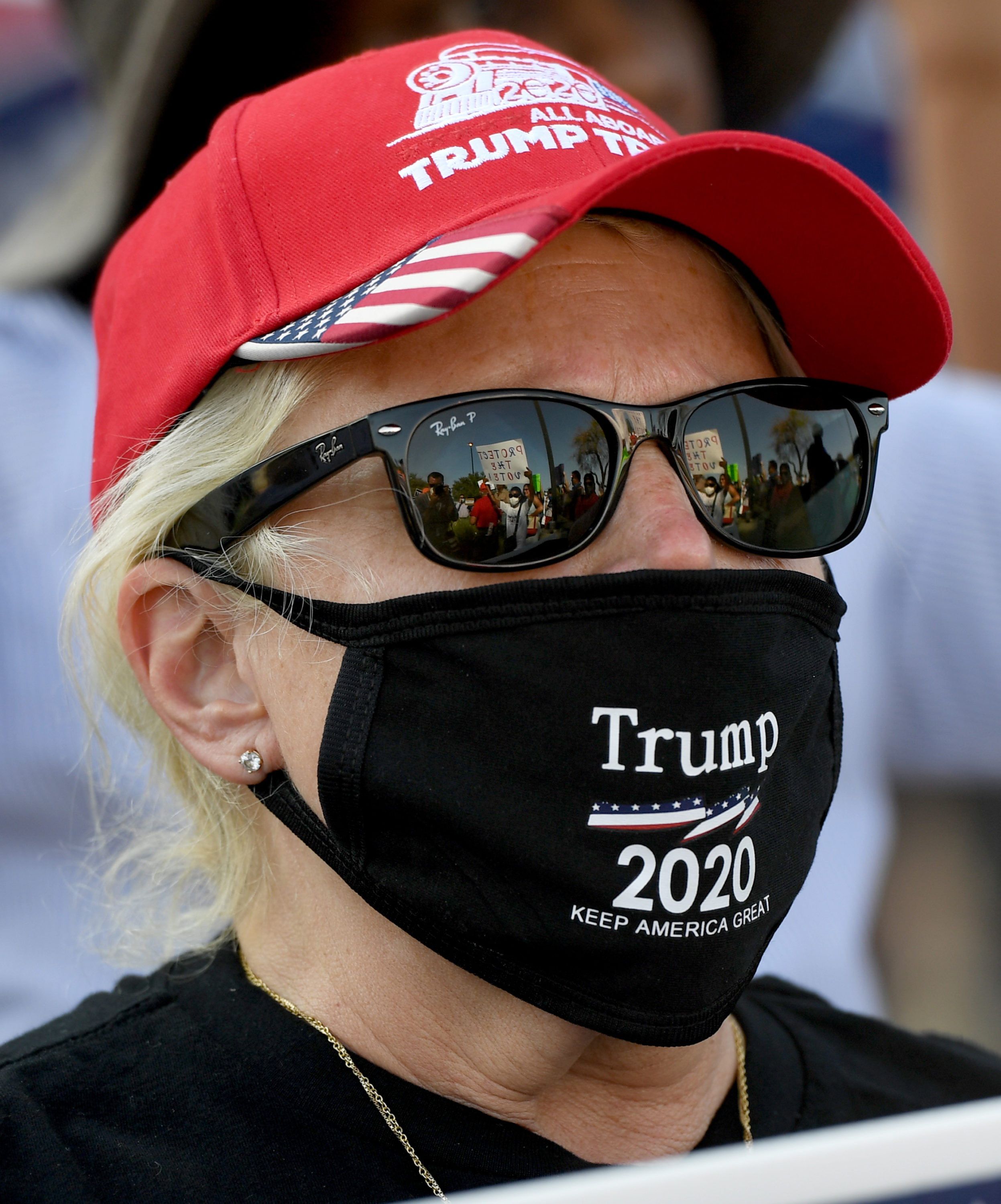 caption: A person protests against the passage of a mail-in voting bill during a Nevada Republican Party demonstration at the Grant Sawyer State Office Building on August 4, 2020 in Las Vegas, Nevada. (Ethan Miller/Getty Images)