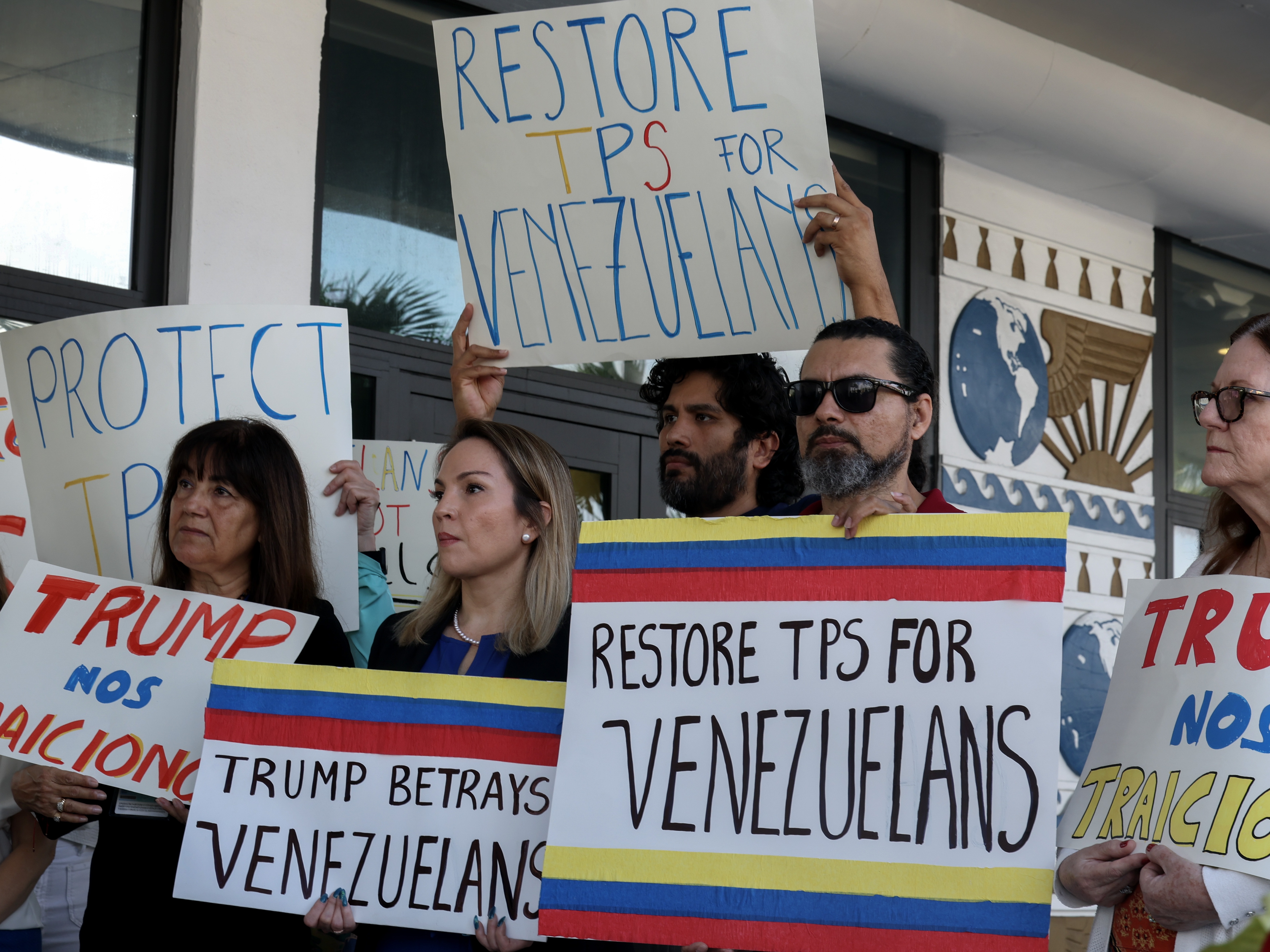 caption: Protesters in Miami support a resolution in favor of reinstating temporary protected status for Venezuelans on Feb. 13, 2025. In early February,  the Trump administration revoked temporary protected status for around 350,000 Venezuelans who fled the country and immigrated to the United States.