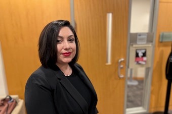caption: Yessenia Manzo, a prosecuting attorney for King County, spoke at a community forum at Seattle University about anti-Asian hate crimes on Wednesday, Nov. 29, 2023.
