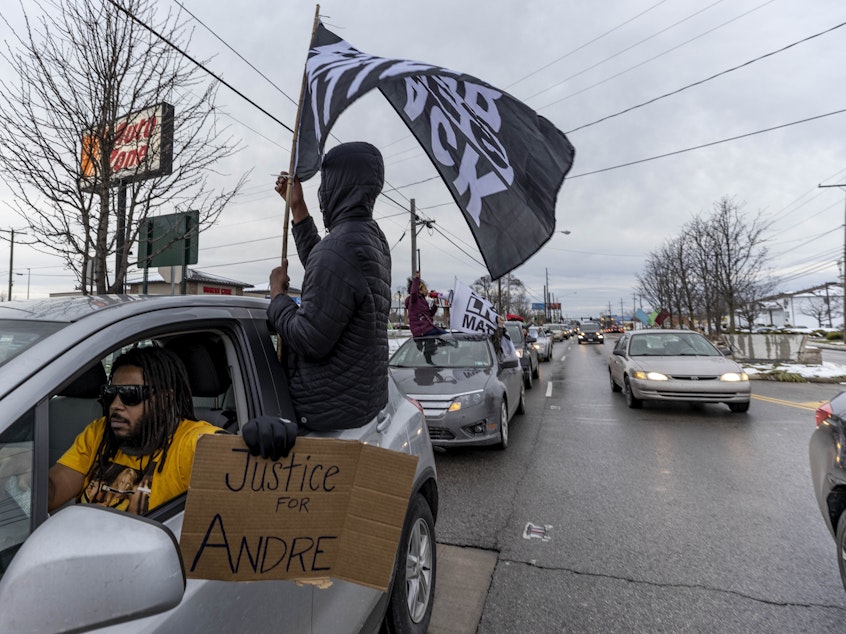 caption: Advocates against police brutality organized a caravan protest after the killing of Andre Hill in Columbus, Ohio. Officer Adam Coy was fired from the Columbus Police Department on Monday for his role in fatally shooting the 47-year-old on Dec. 22.
