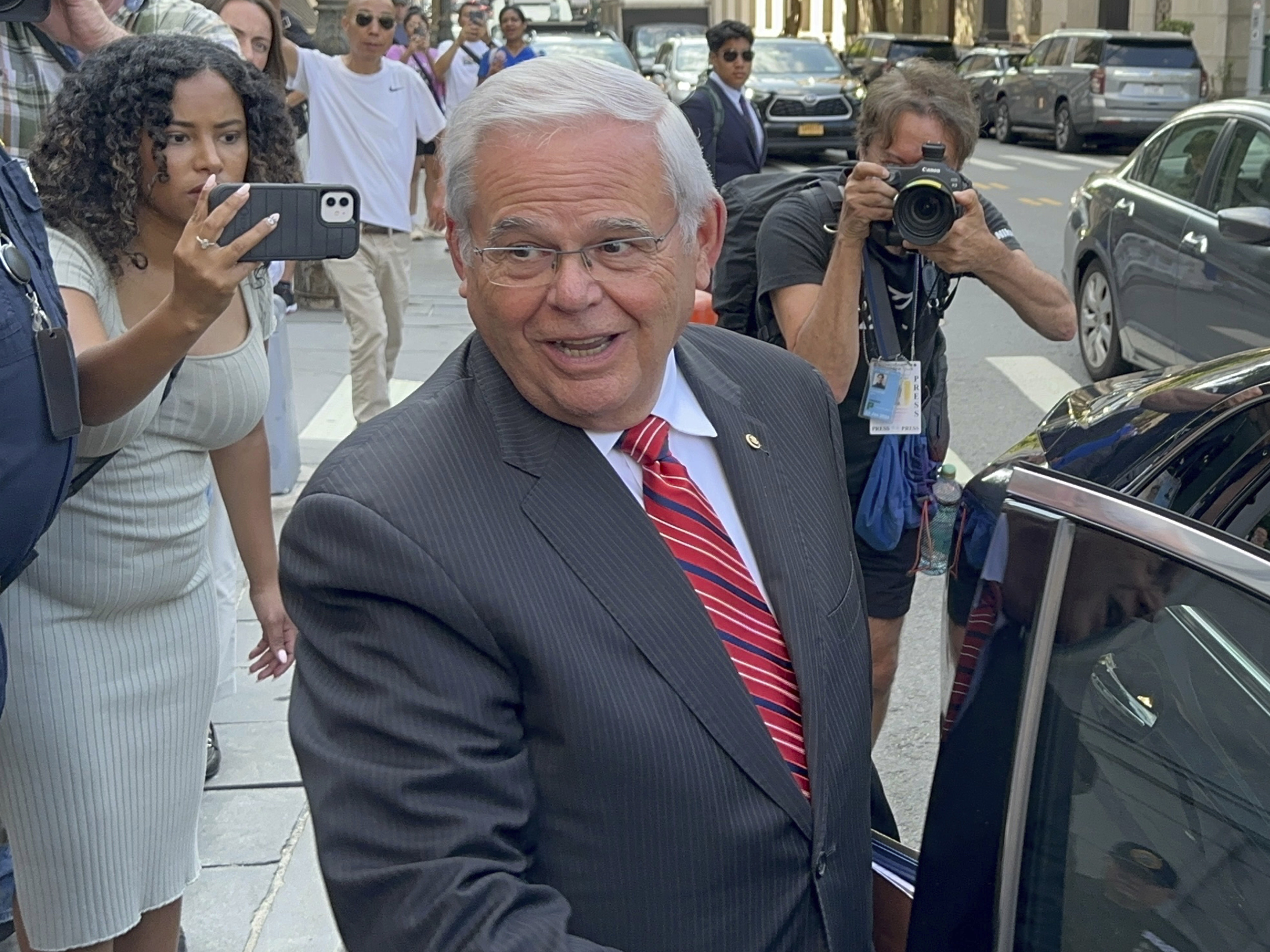 caption: U.S. Sen. Bob Menendez, D-N.J., leaves federal court following the day's proceedings in his bribery trial, Thursday in New York.