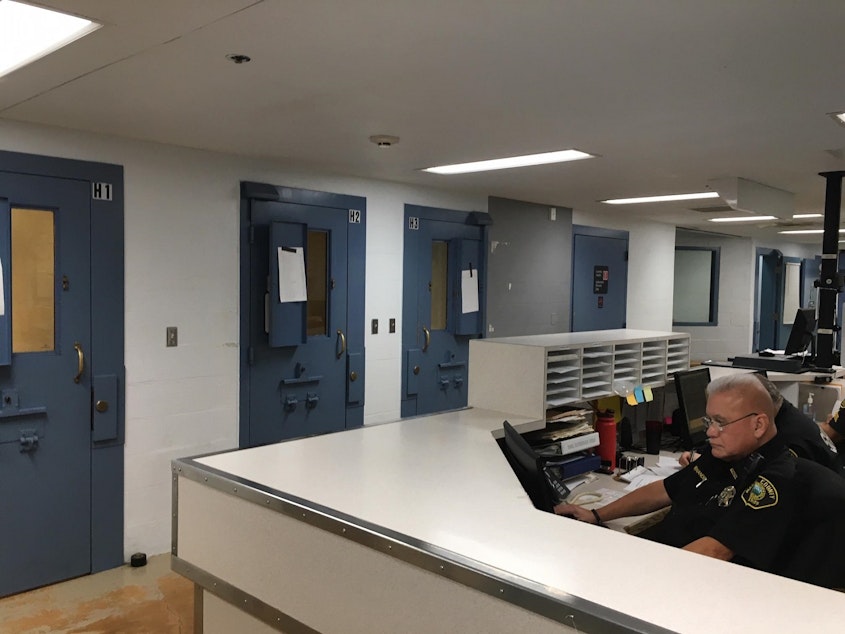 caption: Temporary holding cells in the booking area of the Mason County Jail are used to house higher-risk inmates because of a lack of individual cells in the 35-year-old facility.