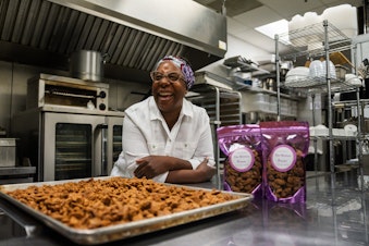 caption: MariChris Brown pictured next to her candied pecans in Tukwila.