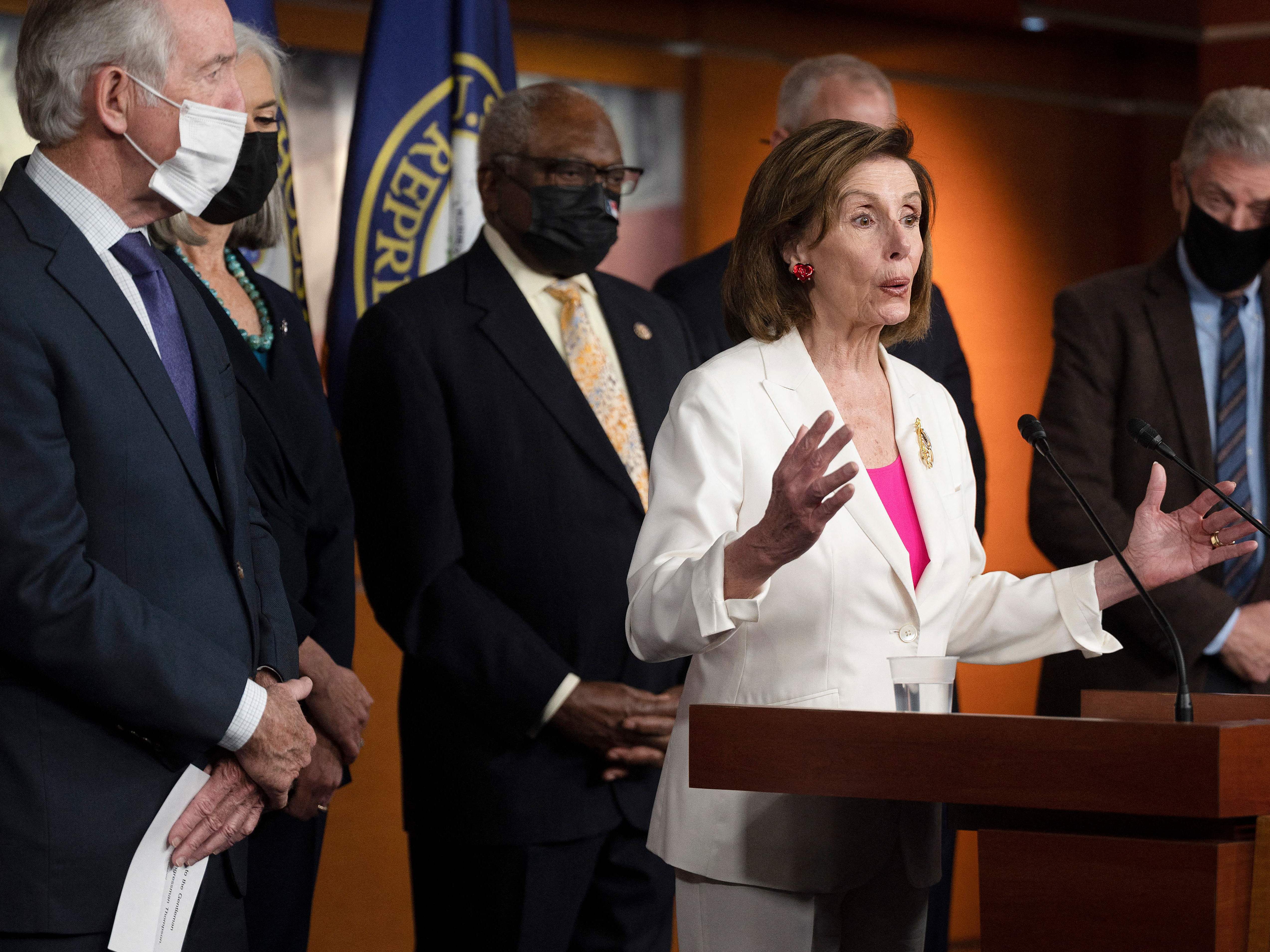 caption: House Speaker Nancy Pelosi, D-Calif., speaks during a Friday news conference with other Democratic leaders after House passage of the Build Back Better Act.
