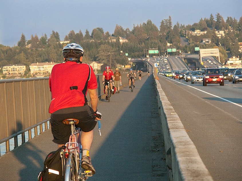 caption: A cycle track puts a physical barrier between bicyclists and car traffic.