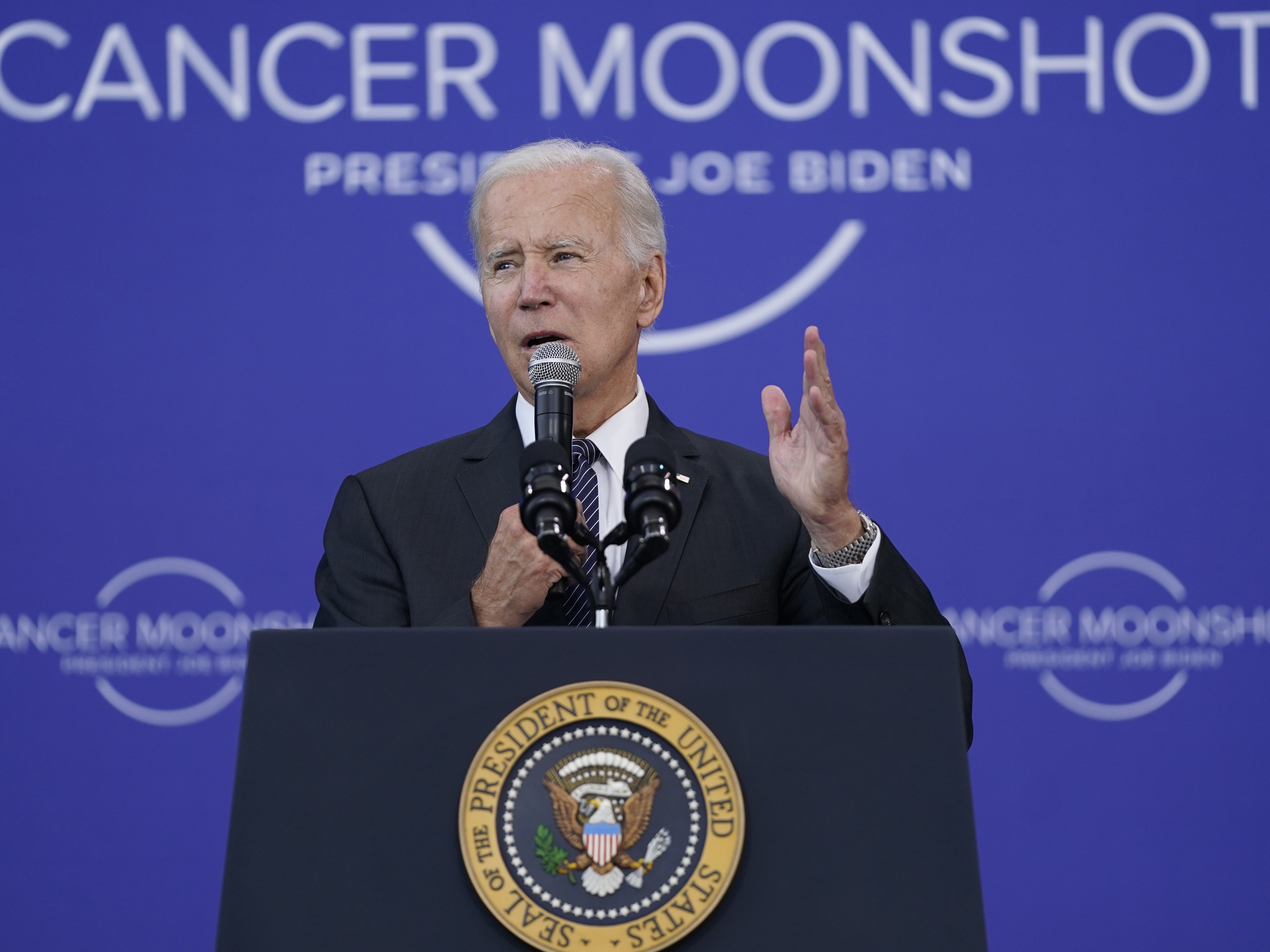 caption: President Joe Biden speaks on the cancer moonshot initiative at the John F. Kennedy Library and Museum in Boston on Sept. 12.