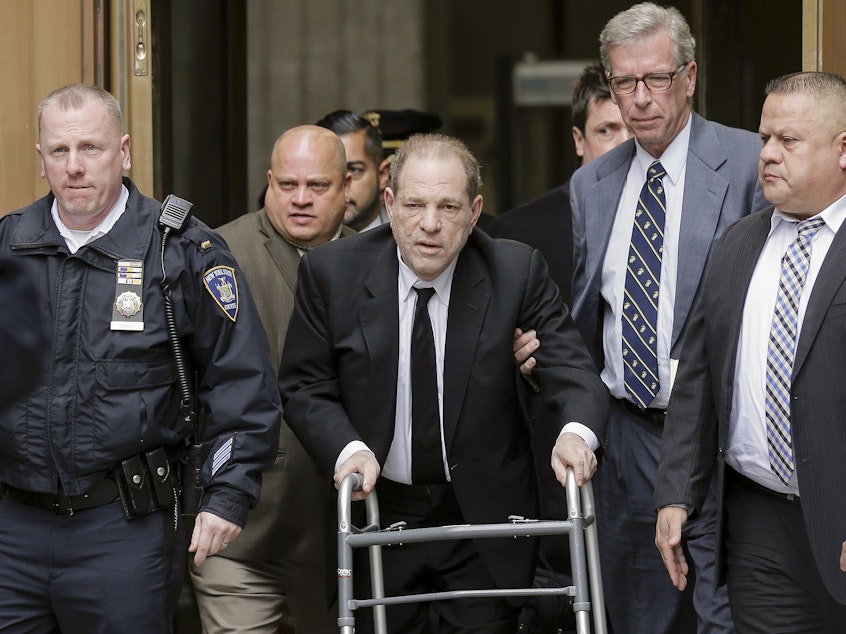 caption: Harvey Weinstein leaves a New York court on Monday, where jury selection has begun. Meanwhile, the Los Angeles County District Attorney's Office says the disgraced movie mogul faces allegations that he sexually assaulted two women in 2013.
