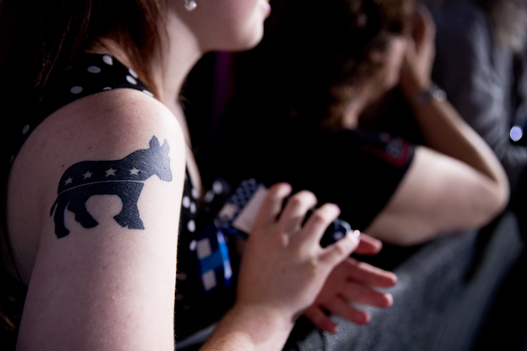 caption: A supporter displays her Democratic donkey tattoo. (Andrew Harnik/AP)