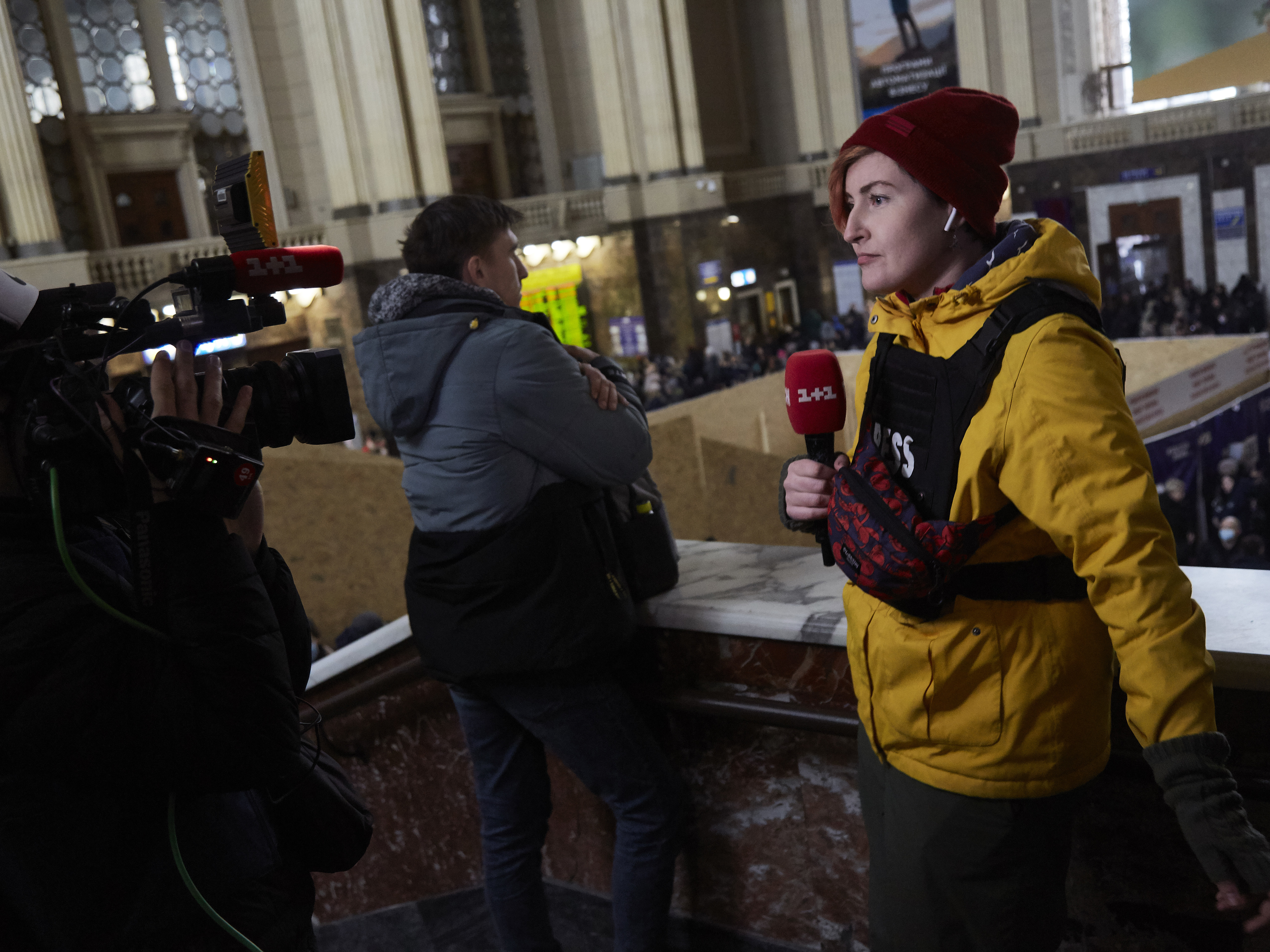 caption: Journalists report from Kyiv, Ukraine, on March 2. Media coverage of Russia's invasion of Ukraine has been massive.