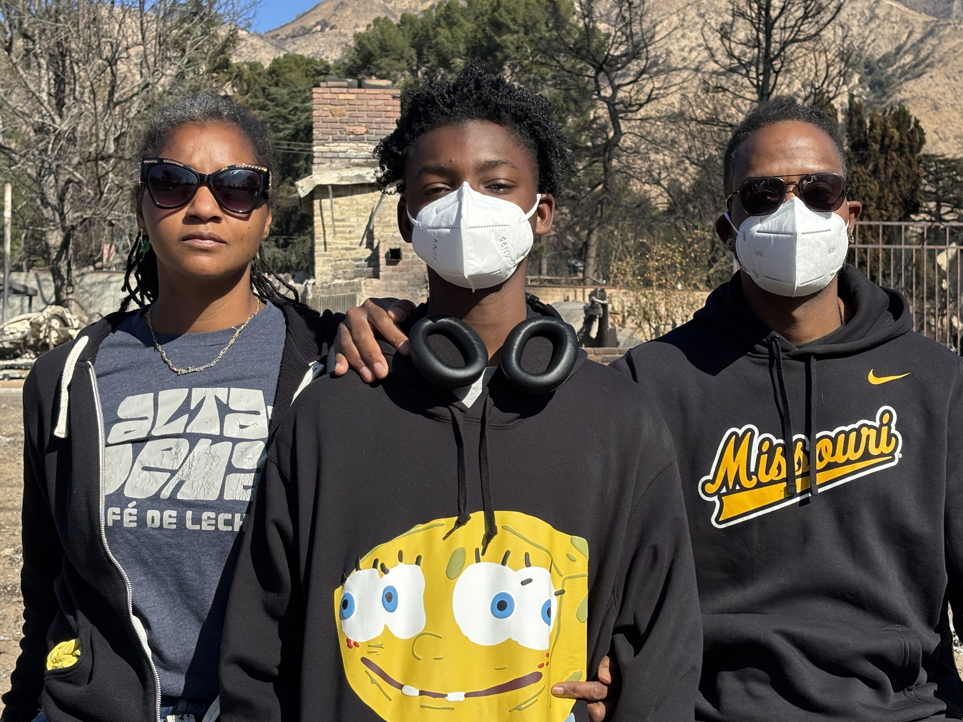 caption: Kwynn Perry, her son Ellison and husband Brian, at their former home in Altadena near Pasadena, Calif.