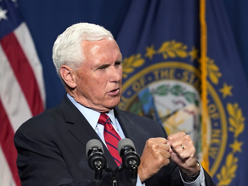 caption: Former Vice President Mike Pence addresses the annual Hillsborough County Lincoln-Reagan Dinner on Thursday night in Manchester, N.H. He called Jan 6 "a dark day" in the history of the U.S. Capitol.