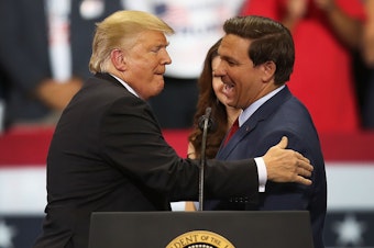 caption: Then-President Donald Trump greets then-Florida Republican gubernatorial candidate Ron DeSantis during a campaign rally at the Hertz Arena on Oct. 31, 2018 in Estero, Fla. In 2024, the two candidates may run against one another for president.