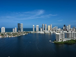 caption: Driven by new regulations, developers are tearing down many older buildings on the waterfront in Miami and other cities in Florida and replacing them with luxury condominiums.