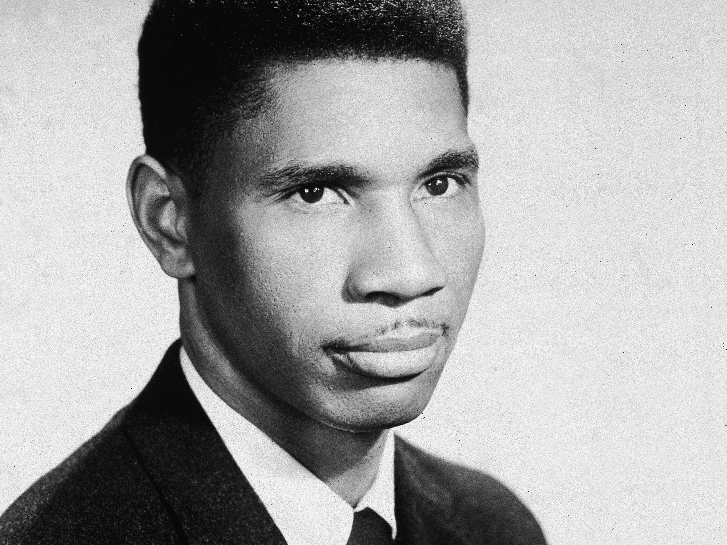 caption: A studio portrait of slain civil rights activist Medgar Evers taken in the early 1960s.