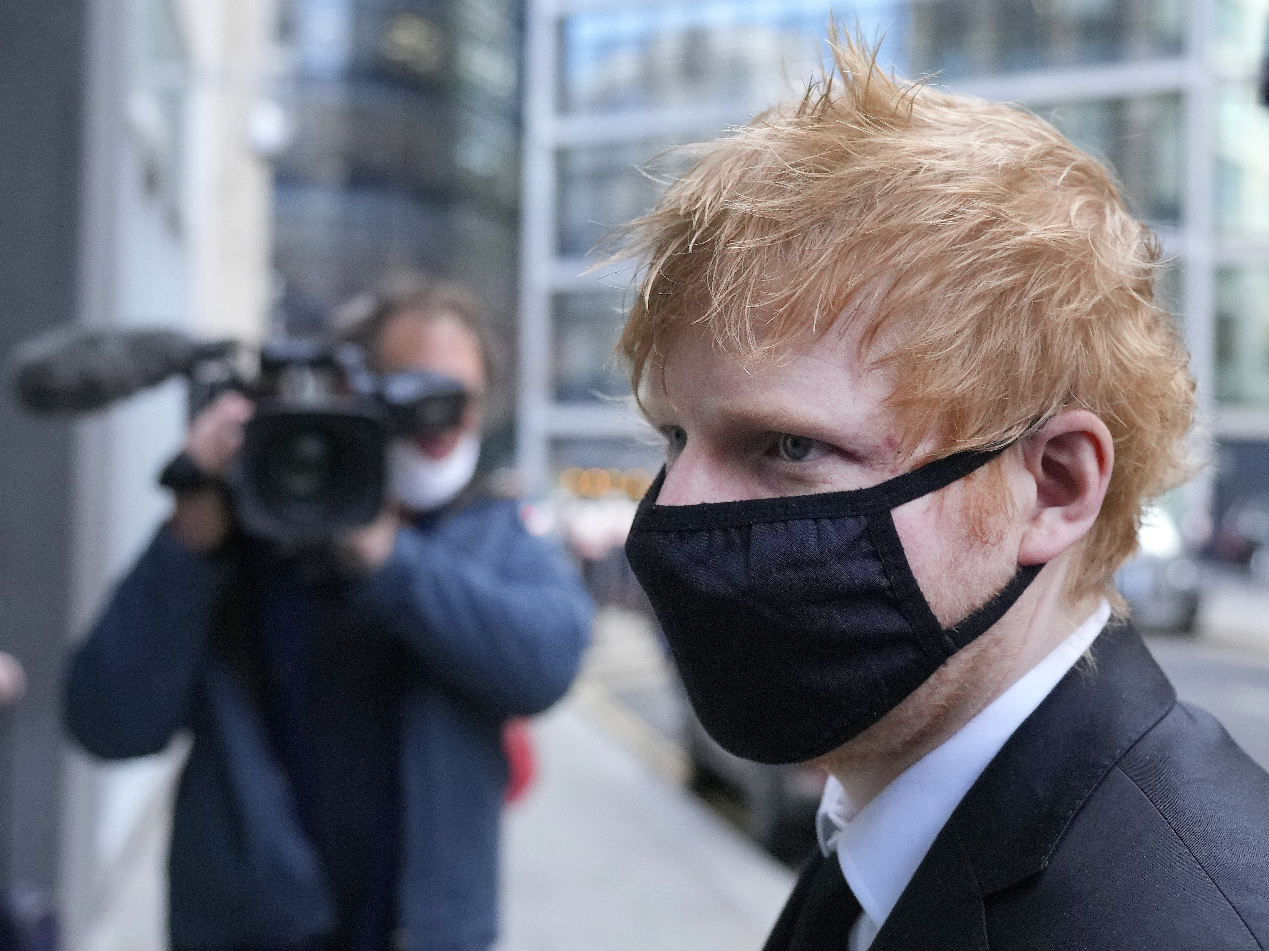 caption: Musician Ed Sheeran arrives at the Rolls Building, High Court in central London, last month.