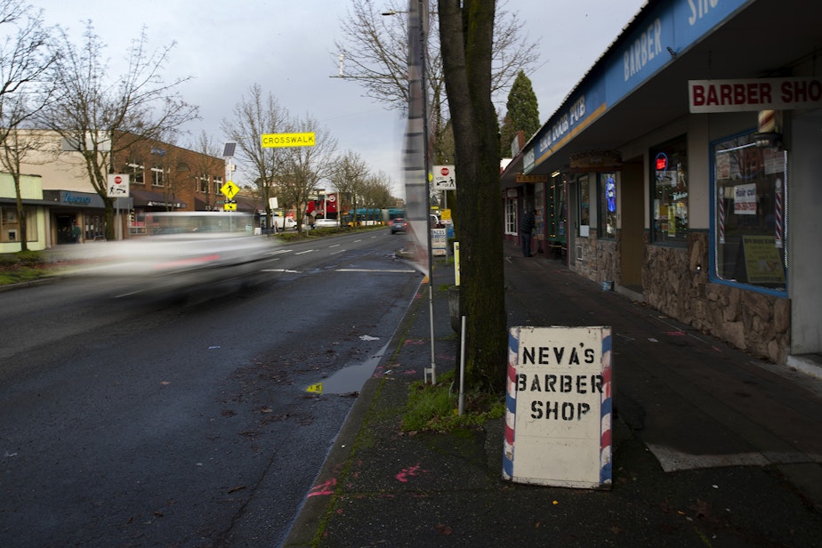 caption: Cars are shown traveling north on Lake City Way Northeast on Monday, December 17, 2018 in Seattle.