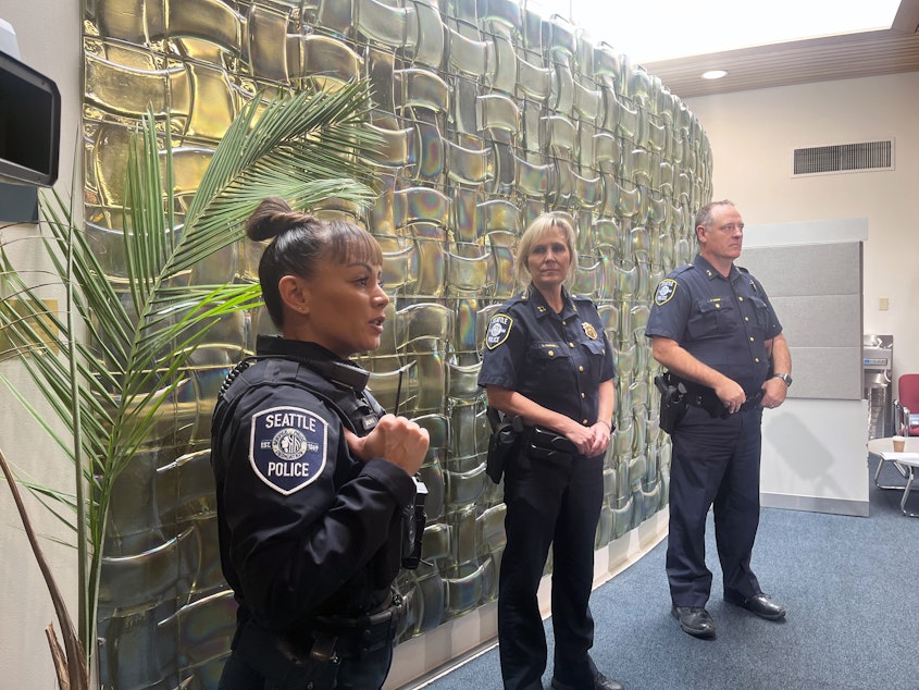caption: Seattle Police held a press conference on Wednesday, Oct. 25, about a recent spate of robberies targeting students in North Seattle. From left, Detective Judinna Gulpan, Captain Lori Aagard, and Assistant Chief Todd Kibbee.