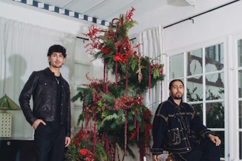 caption: Marco Zamora, a 27 year-old interior decorator/design DIY-er, and Juan "El Creativo" Renteria, a 26 year-old floral artist, initially met over Instagram. The floral floating tree in Zamora's apartment is their first collaboration together.