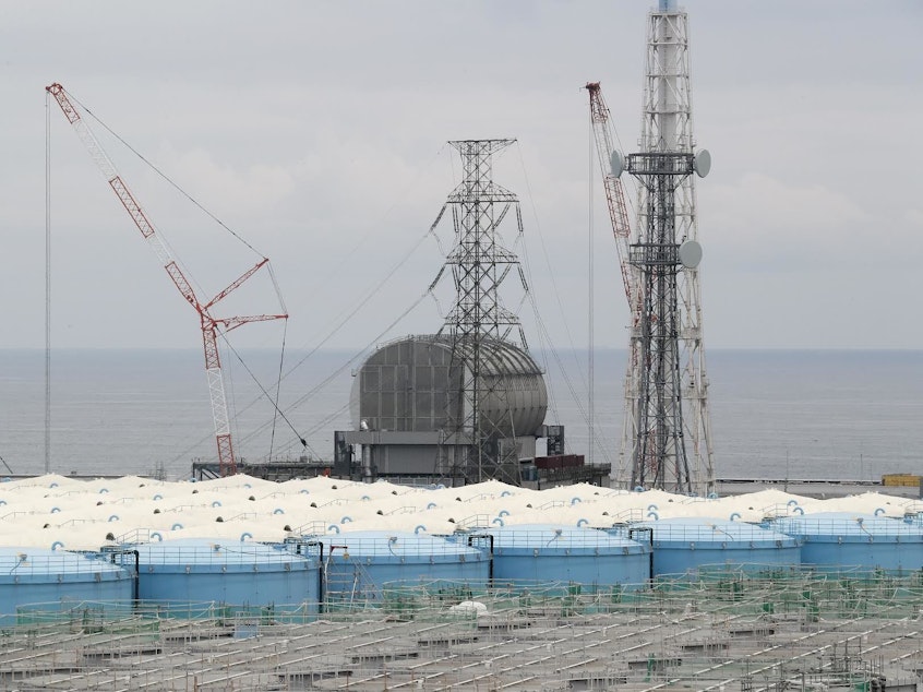 caption: Prosecutors say TEPCO leaders should have known the risks a tsunami could pose to the Fukushima Dai-ichi nuclear power plant, which sits along Japan's eastern coast. Here, the Unit 3 reactor is seen this past summer, amid storage tanks of radiation-contaminated water.