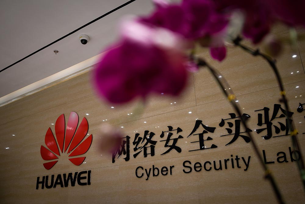 caption: A Huawei logo is seen at the entrance of the Huawei Cyber Security Lab at a Huawei production base during a media tour in Donggguan, China's Guangdong province on March 6, 2019. Chinese telecom giant Huawei gave foreign media a peek into its state-of-the-art facilities on March 6 as the normally secretive company steps up a counter-offensive against US warnings that it could be used by Beijing for espionage and sabotage. (WANG ZHAO/AFP via Getty Images)