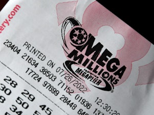 caption: The Mega Millions jackpot has surpassed $1 billion for the third time in the history of the lottery. This illustration photo shows a Mega Millions lottery ticket in Washington, D.C., on Tuesday.