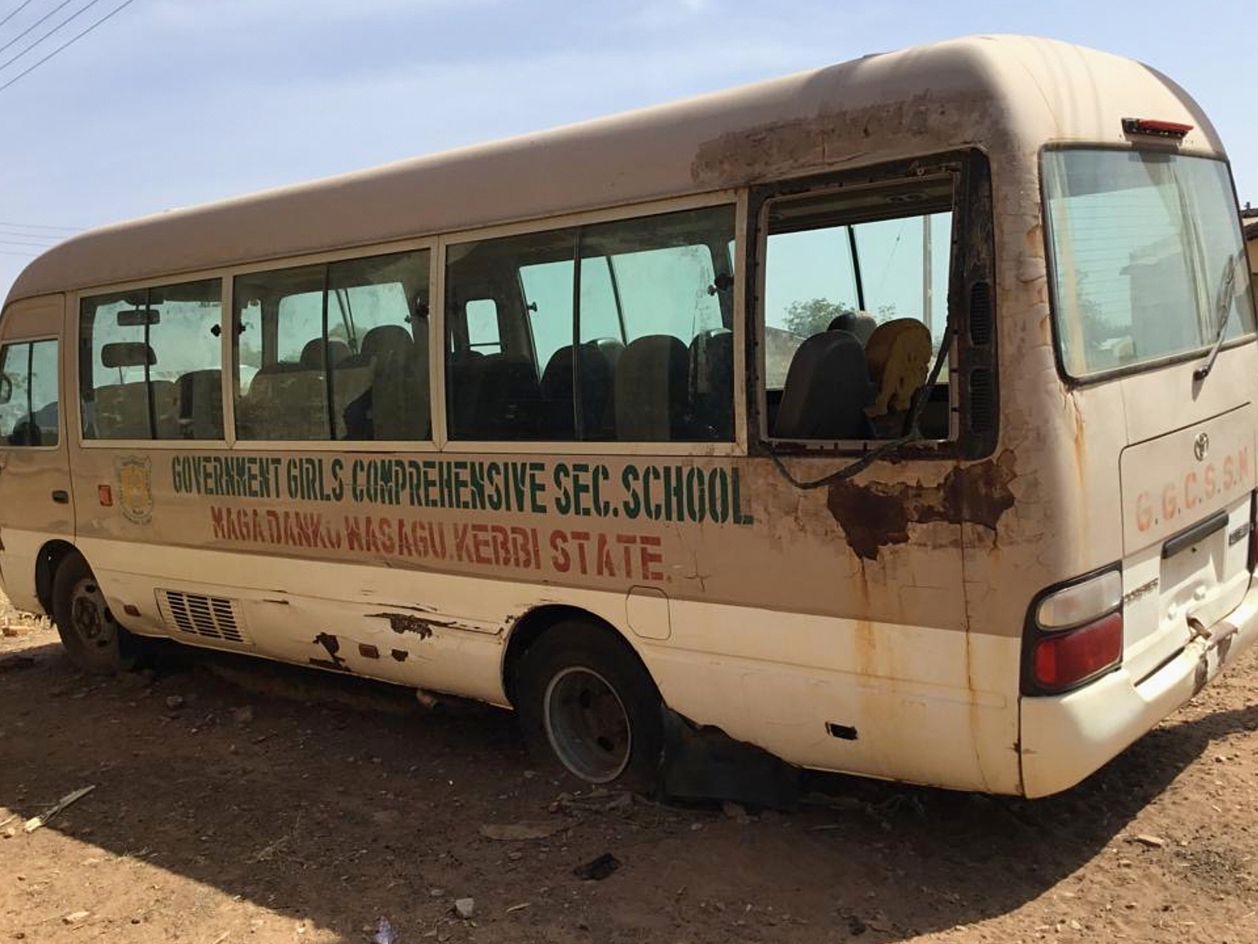 caption: A view of the school bus of the Government Girls Comprehensive Secondary School, where gunmen on Monday attacked the school dormitory and abducted schoolgirls, is seen in Kebbi, Nigeria, Tuesday, Nov. 18, 2025.