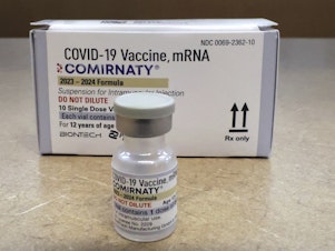 caption: Comirnaty, a new Pfizer/BioNTech vaccination booster for COVID-19, is displayed at a pharmacy in Orlando, Fla., on Friday, Sept. 15, 2023.