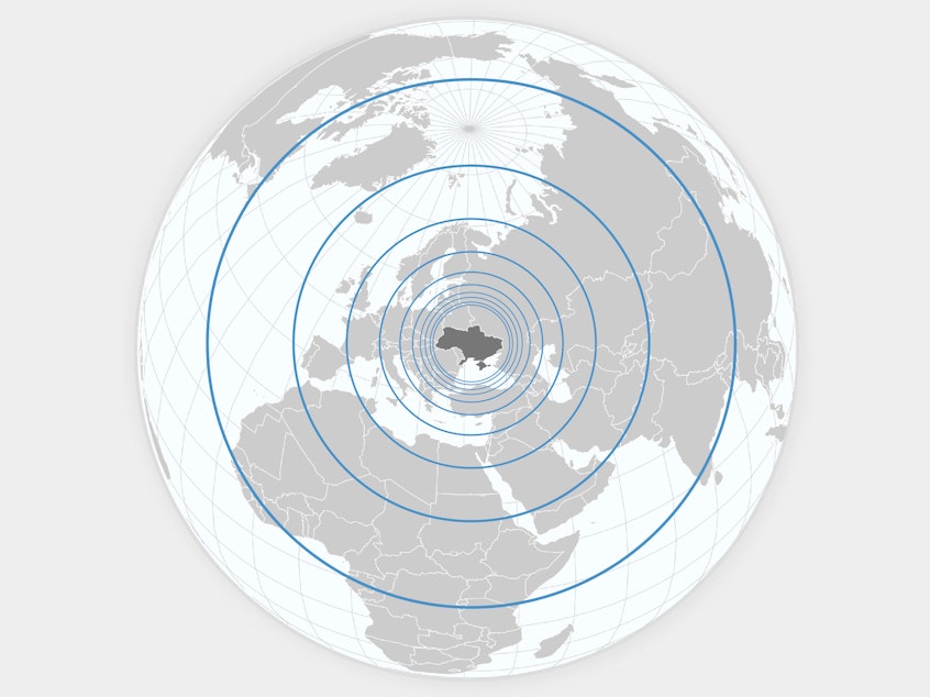 A globe, centered on Ukraine with ripples emanating outwards around the world.