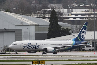 caption: The Alaska Airlines Boeing 737 MAX 9 aircraft is seen at Portland International Airport on Jan. 9, 2024 in Oregon. The plane made an emergency landing following a midair fuselage blowout on Jan. 5. None of the 171 passengers and six crew members was seriously injured.