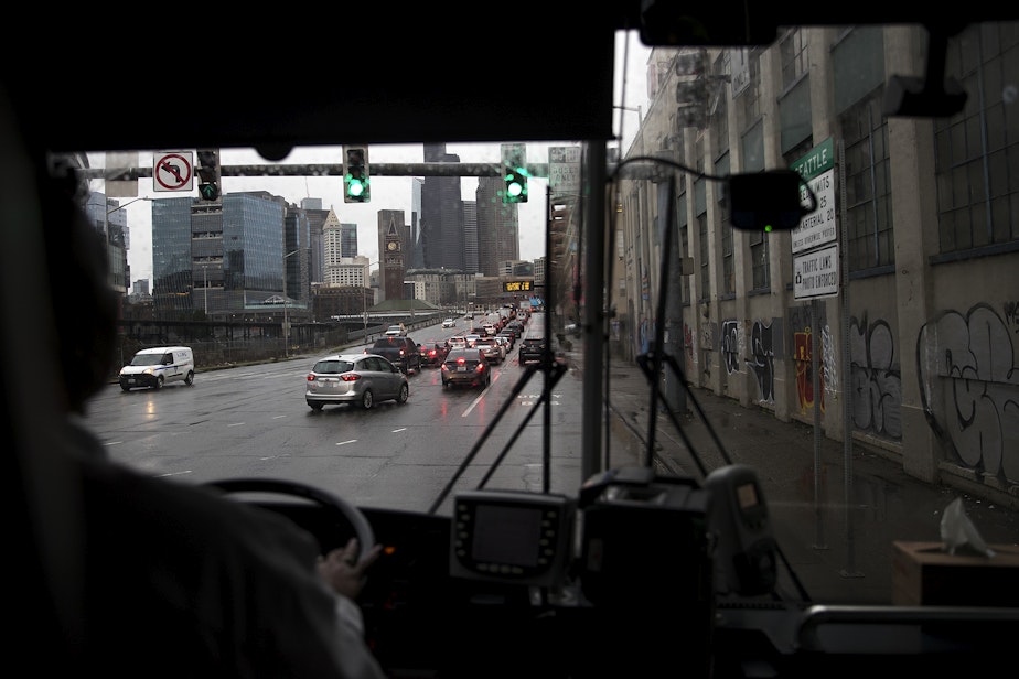 caption: A view of Seattle is shown through the windshield of Sound Transit bus 594 on Wednesday, January 22, 2020.