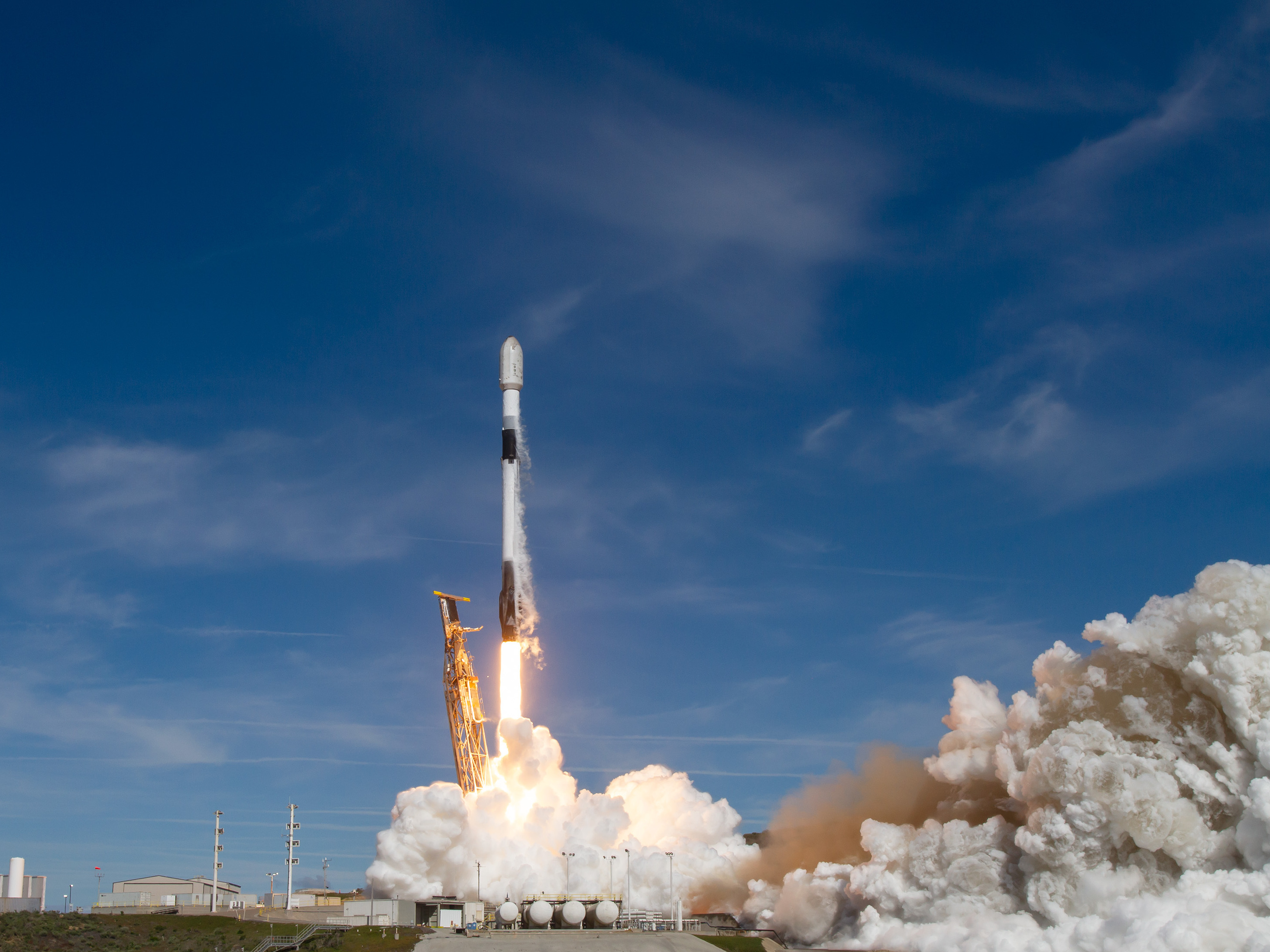 caption: A SpaceX Falcon 9 rocket blasts into space. On board is a satellite with a climate solutions mission. It's designed to detect methane, a potent planet warming gas.