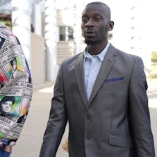 caption: Michael Corey Jenkins, right, follows a friend as he enters the federal courthouse in Jackson, Miss., Wednesday, for sentencing on the third of the six former Rankin County law enforcement officers who committed racially motivated, violent torture on him and his friend Eddie Terrell Parker in 2023. The six former law officers pleaded guilty to torturing them.
