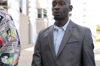 caption: Michael Corey Jenkins, right, follows a friend as he enters the federal courthouse in Jackson, Miss., Wednesday, for sentencing on the third of the six former Rankin County law enforcement officers who committed racially motivated, violent torture on him and his friend Eddie Terrell Parker in 2023. The six former law officers pleaded guilty to torturing them.