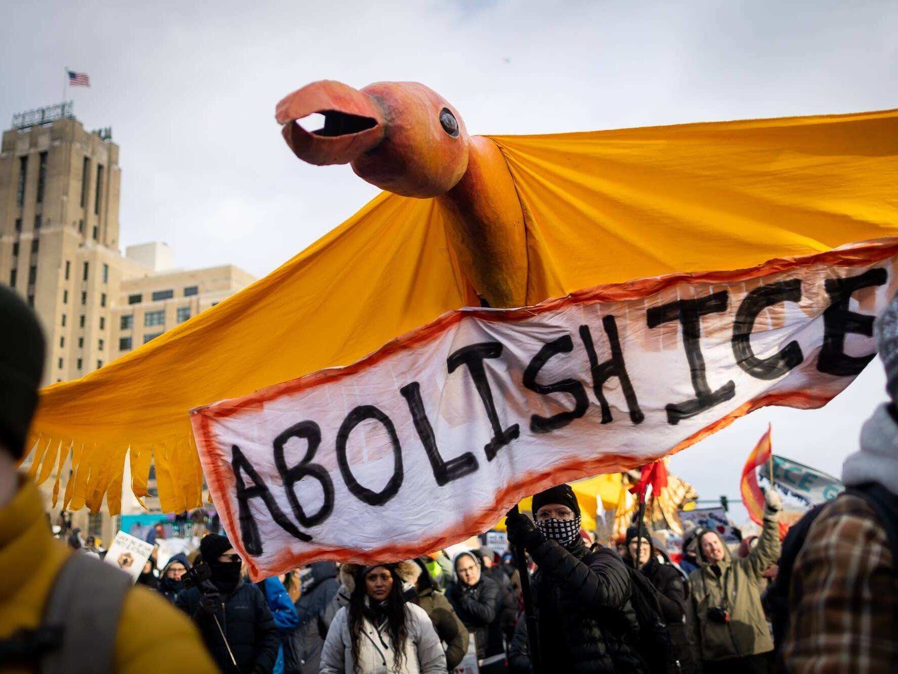 caption: A large bird puppet crafted at In the Heart of the Beast Puppet and Mask Theatre in Minneapolis is carried down Lake Street during a march demanding ICE's removal from Minnesota on Saturday, Jan. 10, 2026.