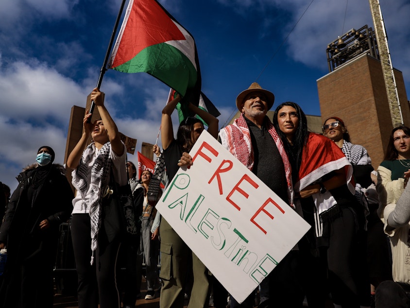 caption: Group of people during the Palestine protest at UW Red Square. Seattle, October 12, 2023