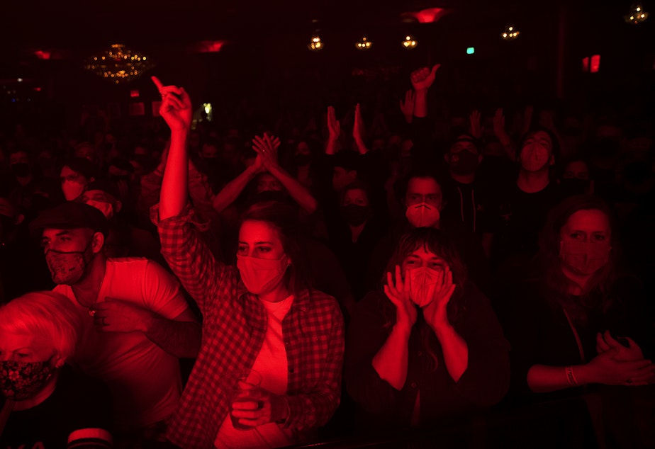 caption: Fans of Deep Sea Diver cheer as the band performs on Friday, November 12, 2021, at Showbox in Seattle. 