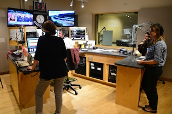 caption: Inside the KUOW control room.
