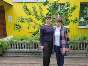 caption: Iryna Andrusha (left) and Kateryna Andrusha, sister and mother, respectively, of Ukrainian school teacher Viktoria Andrusha, who was taken by Russian forces from the village of Novyi Bykiv in late March.