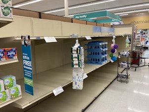 caption: Toilet paper is sold out at a Safeway store in Tumwater, Washington. A wave of 'panic buying' followed news that Gov. Jay Inslee was instituting tough new restrictions to address a third wave of Covid-19.