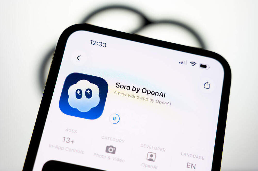 caption: The Sora download page on Apple's App Store appears on a smartphone screen with the OpenAI logo in the background. OpenAI's top-ranked video creation and sharing app is controversial for its ability to create fake news and its disregard for copyright in Creteil, France, on October 9, 2025. (Photo by Samuel Boivin/NurPhoto via Getty Images)