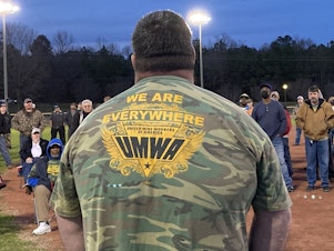 caption: Alabama coal miners rally at a local ballpark in Brookwood, Alabama. They've been on strike against Warrior Met Coal since April 1.