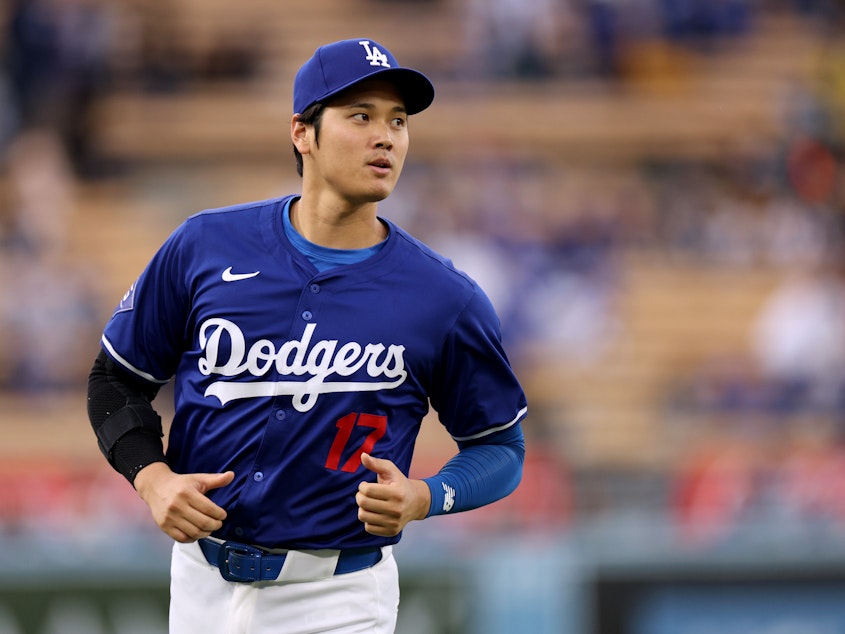 caption: Months after Shohei Ohtani signed a huge deal with the Los Angeles Dodgers in the offseason, the team fired his interpreter over gambling and theft allegations.