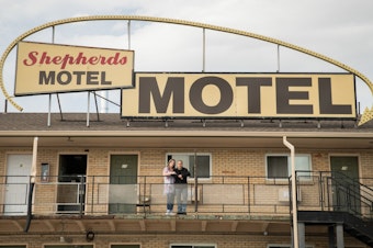 caption: Office manager Shannin Hamilton (left) of the Shepherds Motel in Denver, and Orlando Martinez, co-owner, say that as the coronavirus pandemic begins to cause economic strain in the U.S., the motel's guests have started asking for help paying for rooms.