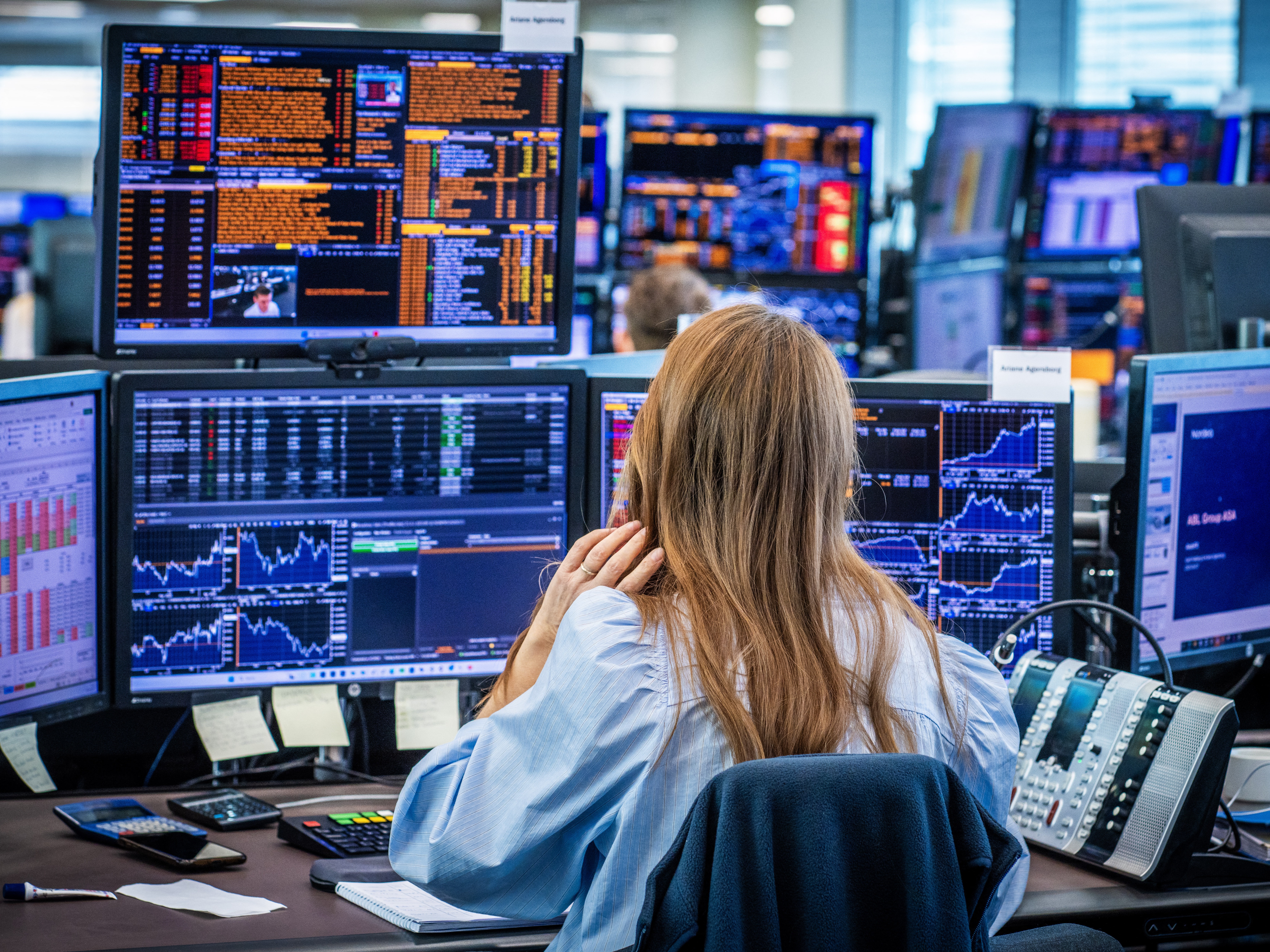 caption: Employees in the trading room of Nordea Markets follow Monday's sharp stock market declines in Oslo. The Trump administration's tariffs are fueling concerns about the prospect of a recession, in the U.S. and globally.