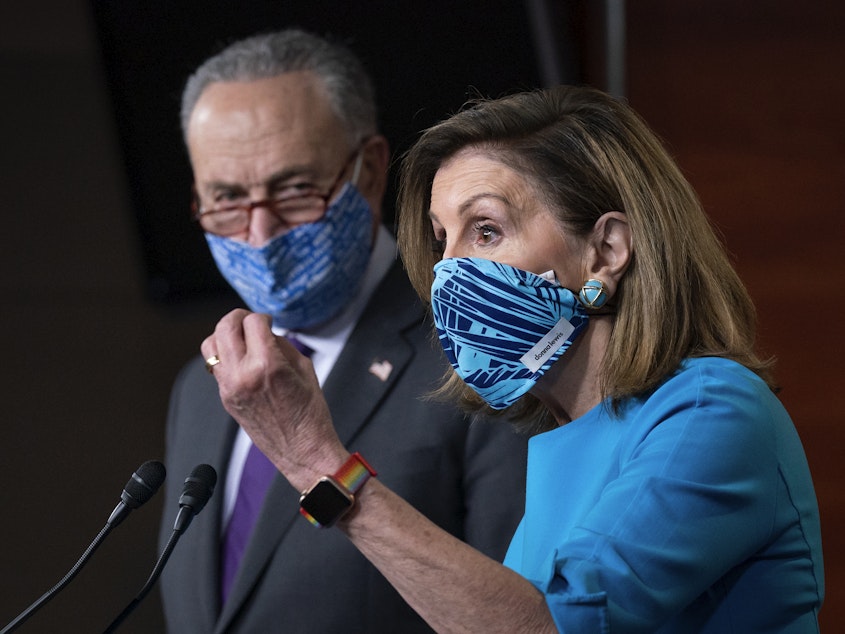 caption: House Speaker Nancy Pelosi, D-Calif., and Senate Minority Leader Chuck Schumer, D-N.Y., are breaking from their demand for more than $2 trillion in coronavirus relief spending to move toward a compromise.