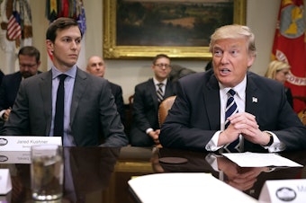 caption: President Trump delivers remarks at the beginning of a 2017 meeting with his son-in-law and senior adviser, Jared Kushner. Andrea Bernstein's new book, American Oligarchs, argues that both the Trump and Kushner families have benefited from the intersection of money and politics.
