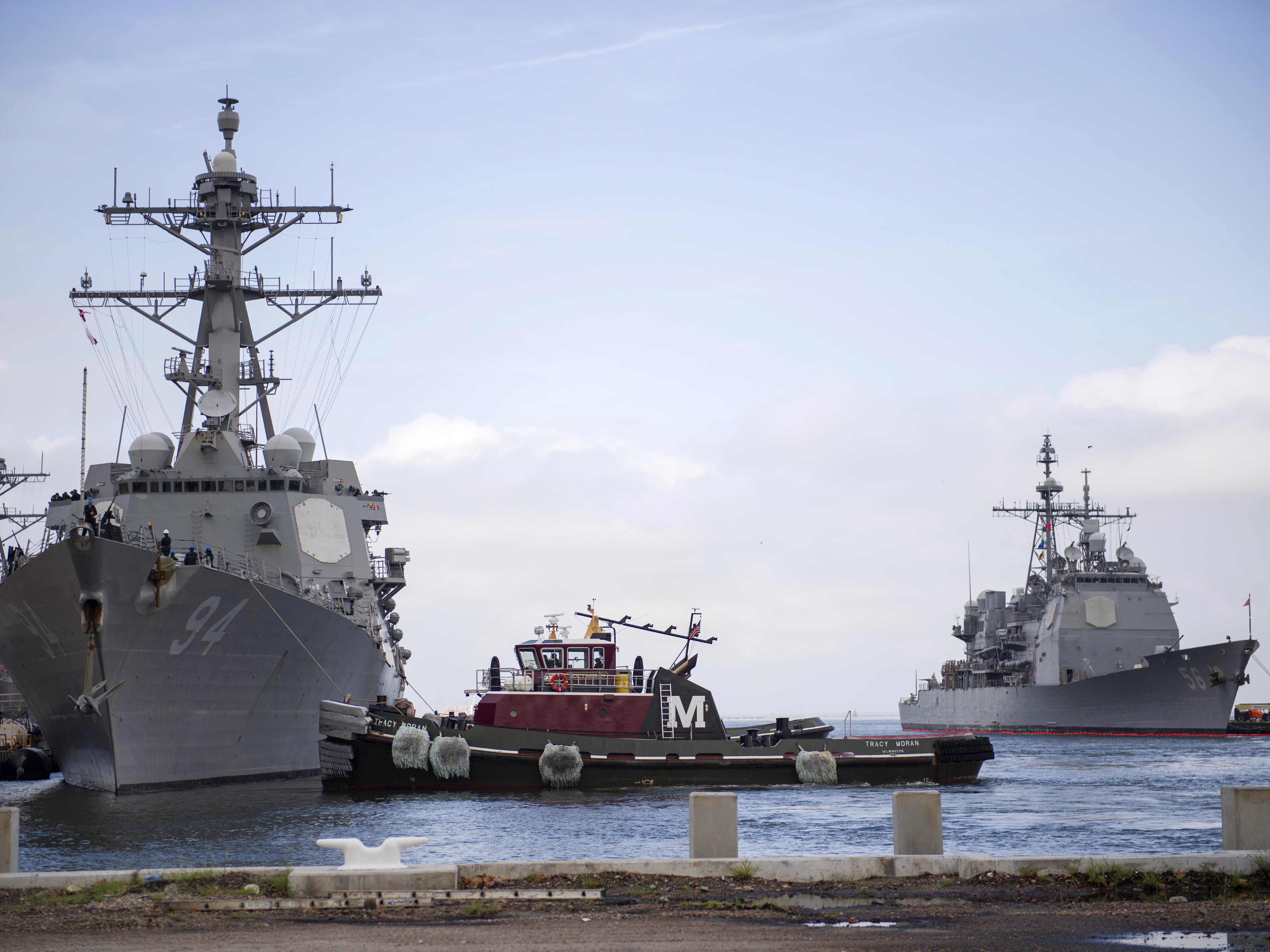 caption: The guided-missile destroyer USS Nitze departs Naval Station Norfolk ahead of Hurricane Florence, in Norfolk, Va., on Monday.
