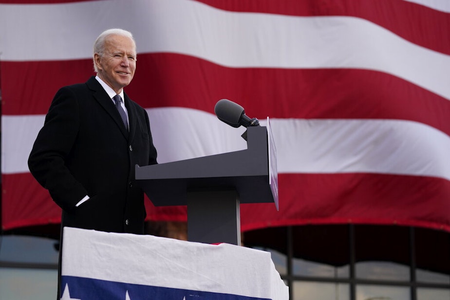 caption: President-elect Joe Biden speaks at the Major Joseph R. "Beau" Biden III National Guard/Reserve Center, Tuesday, Jan. 19, 2021, in New Castle, Del. The day before his inauguration.