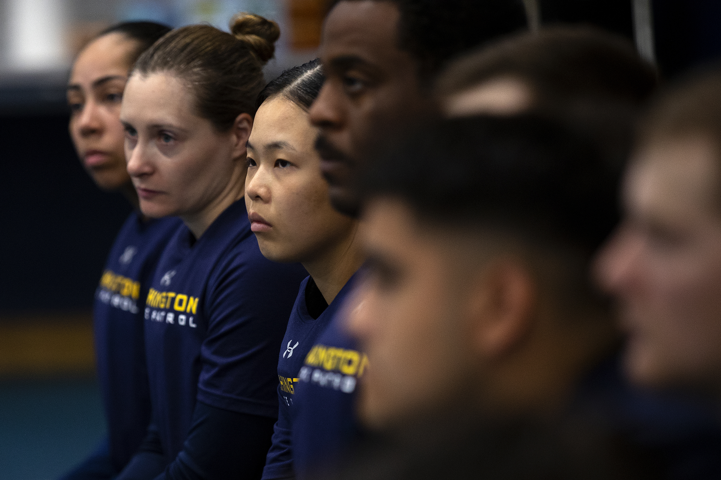caption: Jisu Choi, 23, center, listens before a training exercise during State Trooper basic training on Thursday, July 11, 2024, at the Washington State Patrol Academy in Shelton. 